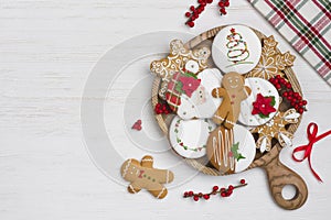 Christmas homemade gingerbread cookies on wooden plate with copy space