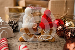 Christmas homemade gingerbread couple cookies on vintage wooden table. Christmas festive closeup.