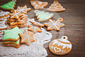 Christmas homemade gingerbread house cookie wooden background