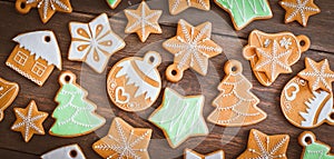 Christmas homemade gingerbread house cookie wooden background