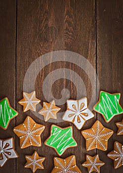 Christmas homemade gingerbread house cookie wooden background