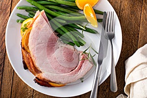 Christmas honey glazed ham served on a plate