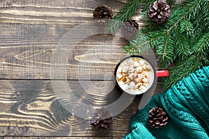 Christmas hot chocolate or cocoa with marshmallows on the wooden background and decor. Top view and copy space.