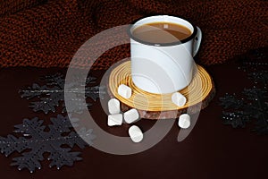 Christmas hot chocolate on a dark background with silver snowflakes