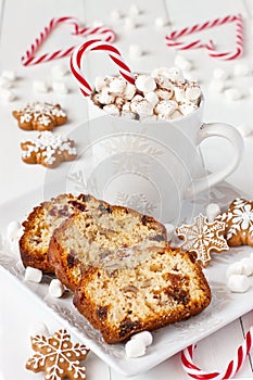 Christmas hot chocolate,  gingerbread cookies and  stollen   on light background