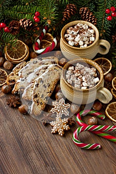 Christmas hot chocolate,   gingerbread cookies and  stollen   on wooden background