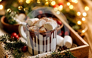 Christmas hot chocolate with marshmallows sprinkled with cinnamon on a festive table close up view.