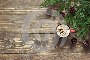 Christmas hot chocolate with marshmallows on the wooden background. Top view with copy space.