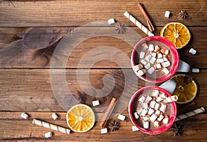 Christmas hot chocolate with marshmellow on old wooden background