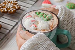 Christmas hot chocolate with snowman marshmallow in the cup
