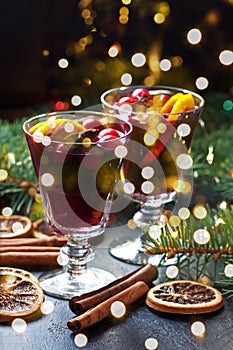 Christmas hot drink in glass and  fir tree branches