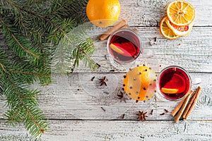 christmas hot mulled wine with cinnamon orange and anise on white wooden background
