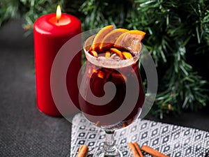 Christmas hot mulled wine with cinnamon, orange and tree on board