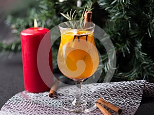 Christmas hot mulled wine with cinnamon, orange and tree on board