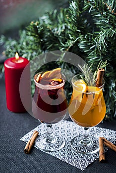 Christmas hot mulled wine with cinnamon, orange and tree on board