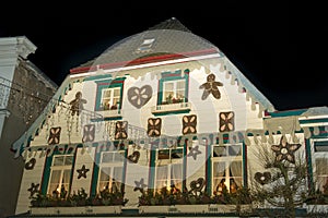 Christmas House in Germany decorated with hearts and stars made of gingerbread like the house in the tale of Hansel and Gretel 