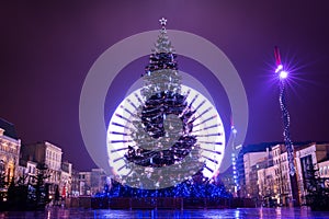 Christmas illumination, big wheel, christmas tree on the Place de Jaude in Clermont-Ferrand, Auvergne, France.