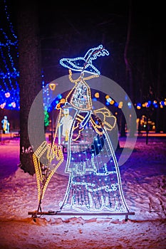Christmas illumination in the Park - woman with umbrella