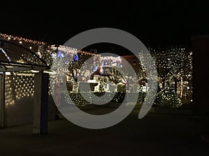 Christmas illumination of spot lights on house walls ans windows Urdorf Switzerland