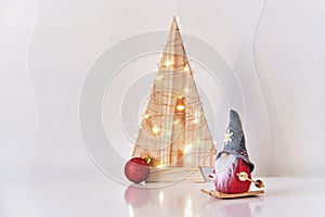 Christmas interior decor. Toys, Christmas gnome on skiing, Christmas tree