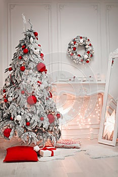 Christmas interior and decorations. Snowy tree decorated red gif