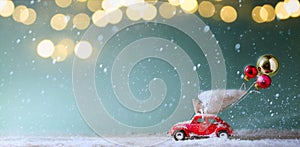 Christmas invitation card background; Christmas tree on toy car, Christmas gift and holidays ornament