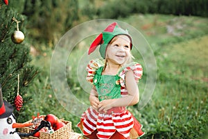 Christmas in july. Child waiting for Christmas in wood in july