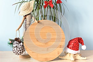 Christmas in July wood round sign mockup in holiday summer background.