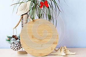 Christmas in july wood round sign mockup in holiday summer background.