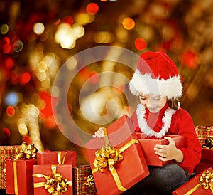 Christmas Kid Opening Present Gift Box, Happy Child in Santa Hat