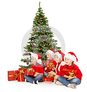 Christmas helpers kids in Santa hat with presents