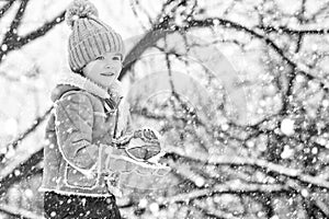 Christmas kids in snow. Theme Christmas holidays New Year. Winter snow and child game. Happy winter time for kid. Joyful