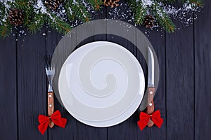 Christmas kitchen, festive dinner, holiday foods. Empty plate wi