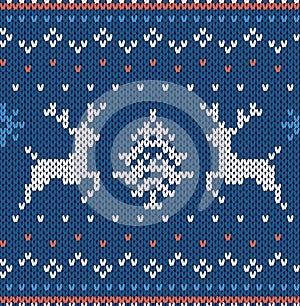 Christmas knit geometric print with deer in blue colors. Knitted seamless texture. Vector illustration
