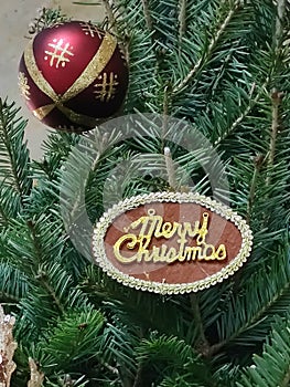 Christmas label, red ball and Christmas tree.