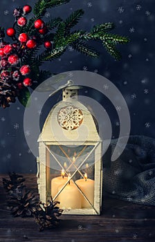 Christmas lantern with burning candles