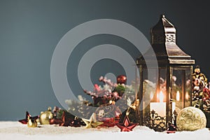 Christmas lantern and decor in snow