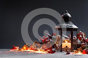 Christmas lantern and decor in snow