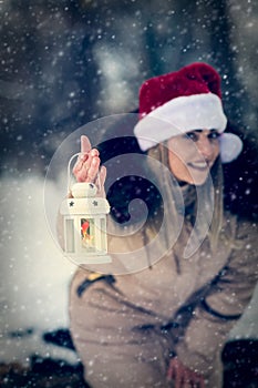 Christmas lantern - girl on winter forest