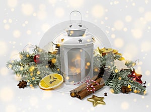 Christmas lantern lamp on white isolated background with fir branch, holiday decor, garland and snow. Cozy wonderland atmosphere