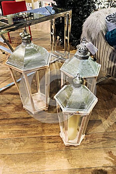 Christmas lanterns with candles in shop in Europea. Christmas decoration sale in store. photo