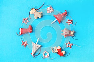 Christmas layout of handmade toys garland on blue background