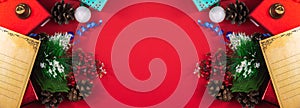 Christmas layout or template on a red background with copy space, New Year\'s atmosphere, gifts and decorations, top view