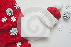 Christmas Letter mockup to Santa Claus with red knitted scarf and hat on background with cones and snowflakes. Place for