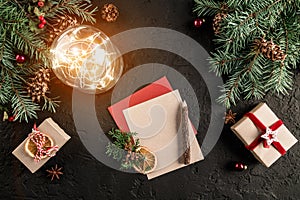 Christmas letter for Santa on dark background with gifts, fir branches, pine cones, glowing ball. Xmas and Happy New Year theme.