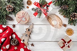 Christmas letter for Santa on white background with gifts, pencil, fir branches, pine cones, candle. Xmas and Happy New Year theme