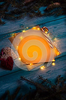 Christmas letter to Santa on a wooden blue table.