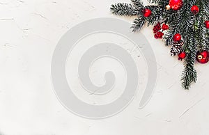 Christmas light background, fir branches with red baubles