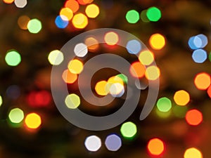 Christmas light background. Holiday glowing backdrop. Defocused Background.