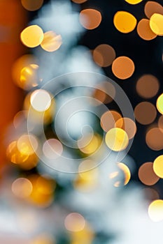 Christmas light background. Holiday glowing backdrop. Defocused background with blurred bokeh